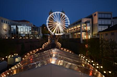 Illuminated Ferris wheel by night