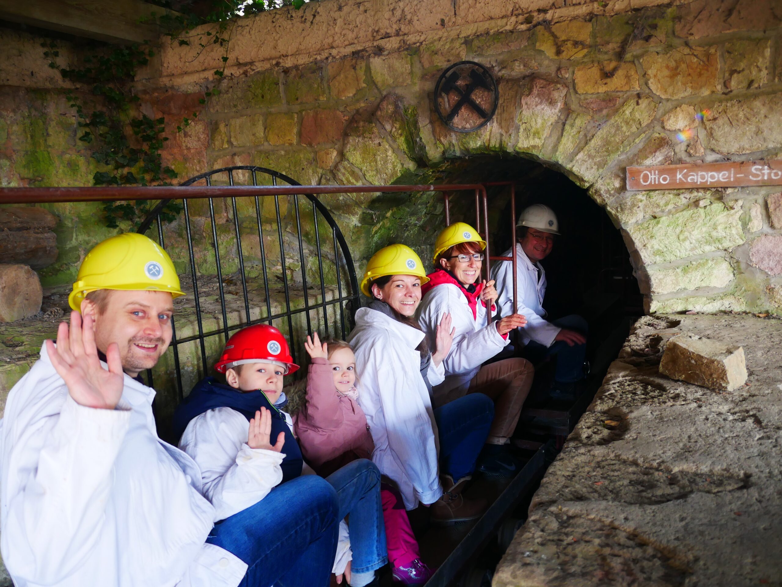 Visitors taking a ride with the mini train through the limestone mine