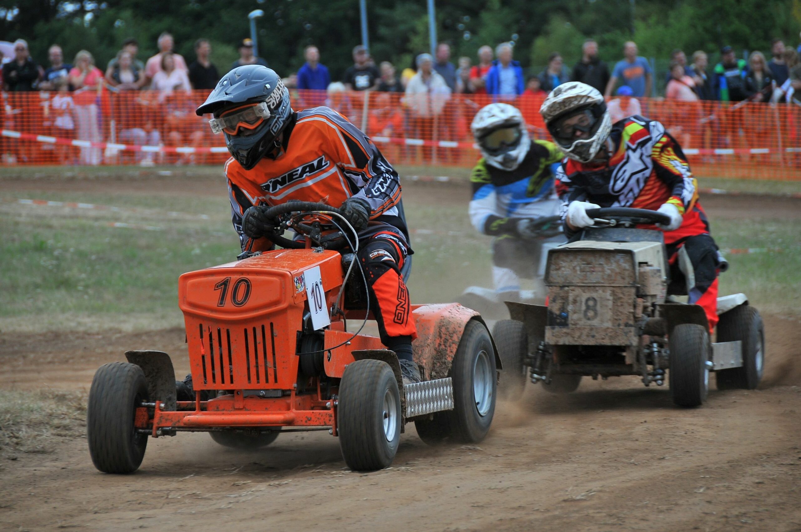 Photo depicting 3 lawn tractor vehicles